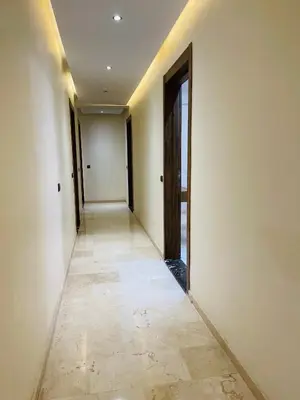 an empty hallway with a door and a tile floor at appart à côté de la gare du train in Marrakech