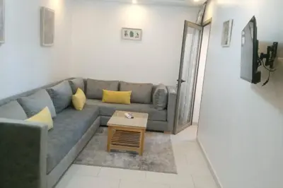 a living room with a couch and a coffee table at Morooco Home in Marrakech