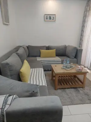 a living room with a couch and a coffee table at Morooco Home in Marrakech