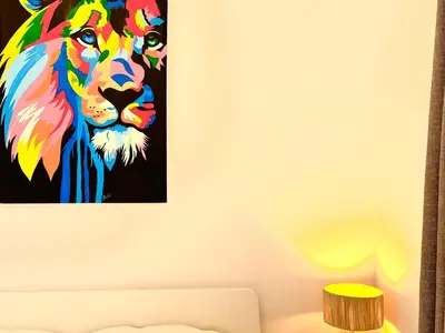 a painting of a lion on a wall at Appartement Dalila in Marrakech