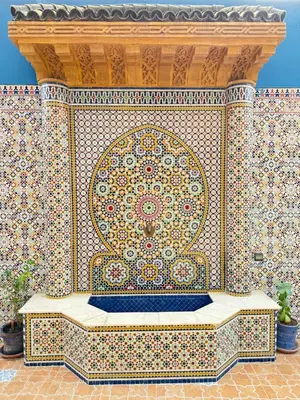 a tiled wall with a fountain in a building at Marrakech aRt in Marrakech