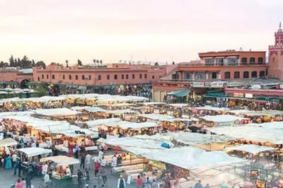 a market with lots of stalls in a city at Appartement funny house a place jamaa el fna de marrakech in Marrakech