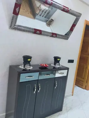 a counter with a mirror on the wall at Appartement de luxe à 7 min de Centre de ville a petit prix pour passer un agréable séjour in Marrakech