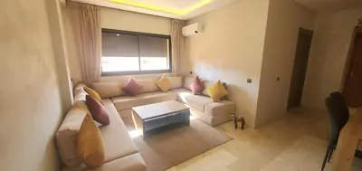 a living room with a couch and a window at Appartement tout neuf en plein centre de Marrakech in Marrakech