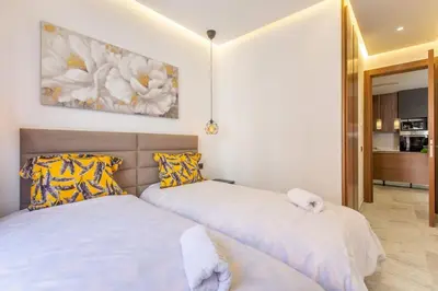 two beds sitting next to each other in a bedroom at New! lovely and cosy flat, like at home in Marrakech