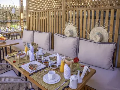 a table with plates of food on top at Riad Almisk in Marrakech