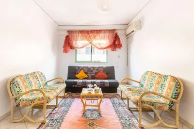 a living room with two chairs and a couch at Espace Harmony in Marrakech