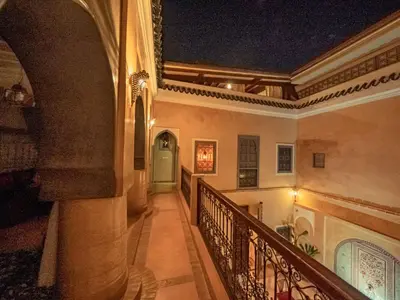 a hallway of a building with a staircase at Riad Azawan in Marrakech