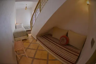 a hammock in a room with a staircase at Riad Marana Hotel & Spa in Marrakech