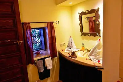 a bathroom with a sink and a mirror at riad dar saba shika in Marrakech
