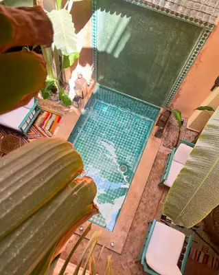 an overhead view of a swimming pool in a house at RIAD DAR NAOMI in Marrakech
