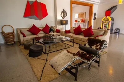 a living room with a couch and a table at Villa Fima Kech in Marrakech
