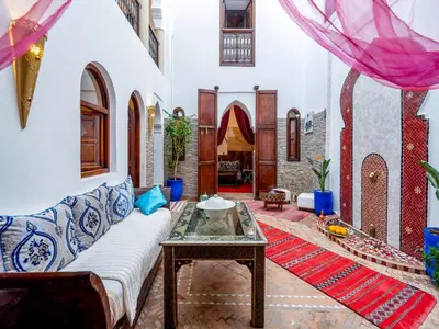 a living room with a couch and a table at Riad Zehar 79 & Spa in Marrakech