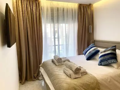 a hotel room with a bed with towels on it at New ! Splendid and cosy apartment in Marrakech