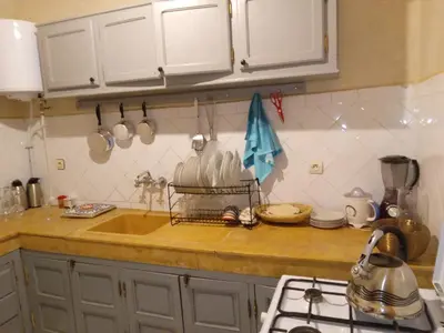 a kitchen with a sink and a counter top at Riad Ben in Marrakech