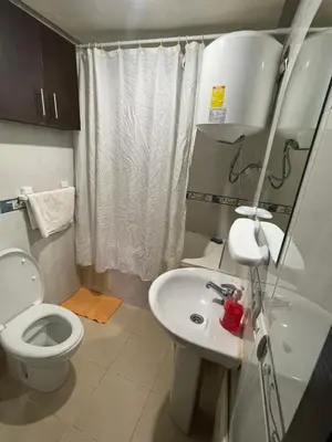 a small bathroom with a toilet and a sink at Appartement 17 3ème étage avec balcon POUR FAMILLE in Marrakech