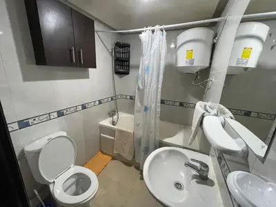 a small bathroom with a toilet and a sink at Appartement 11 2èm étage. (POUR FAMILLE) in Marrakech