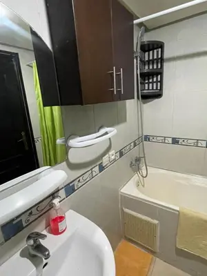 a bathroom with a sink and a toilet and a tub at Appartement 20 3èm étage avec balcon ( POUR FAMILLE ) in Marrakech
