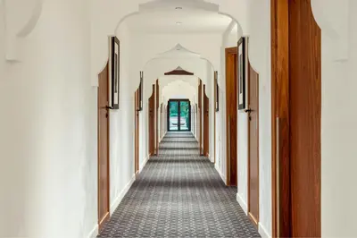 a corridor of a building with a long hallway at Le Meridien N'fis in Marrakech