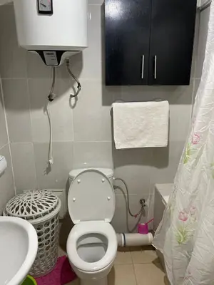 a small bathroom with a toilet and a sink at Appartement 24 4èm étage avec balcon ( POUR FAMILLE ) in Marrakech