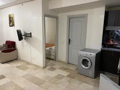 a laundry room with a washing machine in it at Appartement 25 4èm étage ( POUR FAMILLE ) in Marrakech
