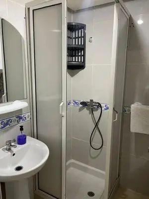 a bathroom with a shower and a sink at Appartement 25 4èm étage ( POUR FAMILLE ) in Marrakech