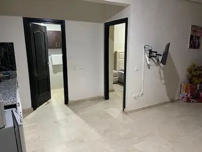 a room with a mirror and a camera on the wall at Appartement 26 au 4ème étage avec balcon ( POUR FAMILLE ) in Marrakech