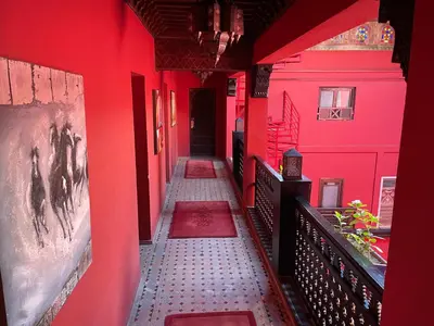 a red hallway with red walls and a tile floor at Riad Marrakech By Hivernage in Marrakech