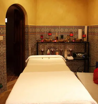 a bedroom with a large white bed in a room at Palais Dar Ouladna in Marrakech
