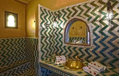 a bathroom with a sink and a mirror at Hotel Kasbah Le Mirage & Spa in Marrakech