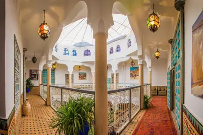 a hallway of a building with a large ceiling at Riad Zinoun & Spa 11 Rooms in Marrakech