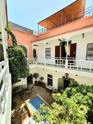 an aerial view of a building with a swimming pool at Riad Dar Zouar & Spa in Marrakech
