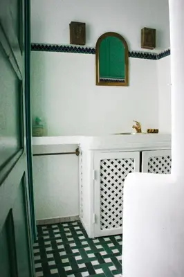 a bathroom with a sink and a mirror at Riad Dar Nael in Marrakech
