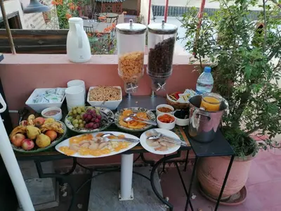 a table filled with plates of food on a table at Riad petit Karmela in Marrakech