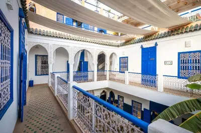 a building with blue and white walls and a balcony at Riad Sheba in Marrakech