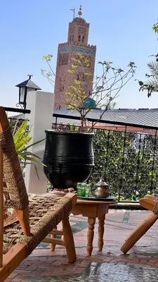 a large black pot sitting on top of a table at Riad Catalina in Marrakech