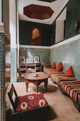 a living room with two couches and a table at Equity Point Marrakech in Marrakech