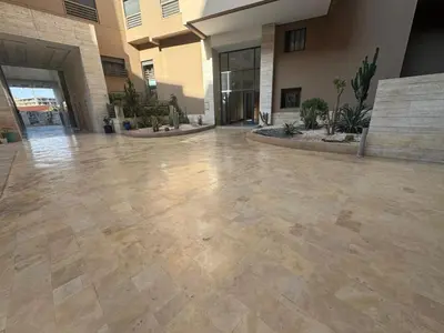 an empty lobby with a tile floor in a building at Appart Kech Menera in Marrakech