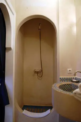 a bathroom with a sink and a shower at Riad Aubrac in Marrakech
