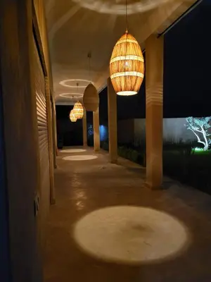 a hallway with two chandeliers hanging from the ceiling at Dar Sofia Villa in Marrakech