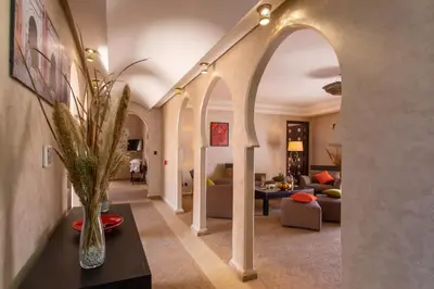 a living room with an archway and a living room at Dellarosa Boutique Hotel and Spa in Marrakech