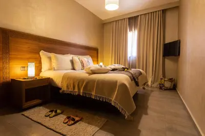 a hotel room with a bed and a window at Dellarosa Boutique Hotel and Spa in Marrakech
