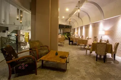 a restaurant with tables and chairs in a room at Dellarosa Boutique Hotel and Spa in Marrakech