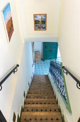 a staircase leading up to the second floor of a house at Riad Med Agorà in Marrakech