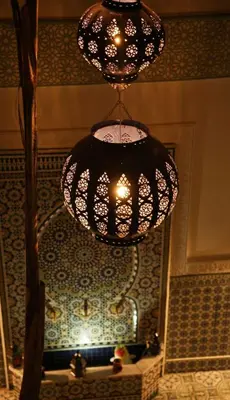 a chandelier hanging from the ceiling in a bathroom at Riad Med Agorà in Marrakech