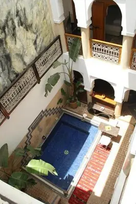an overhead view of a swimming pool in a house at Riad Chalymar in Marrakech
