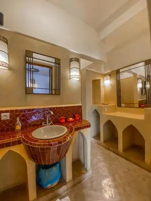 a bathroom with a sink and a mirror at Riad Anya & SPA in Marrakech