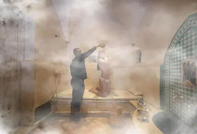 a painting of a man and a woman in a bathtub at Riad Anyssates in Marrakech