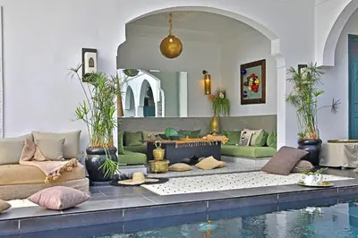 a living room with a pool of water at Riad Anyssates in Marrakech
