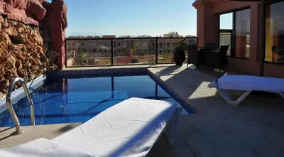 a swimming pool on top of a building at Mont Gueliz in Marrakech